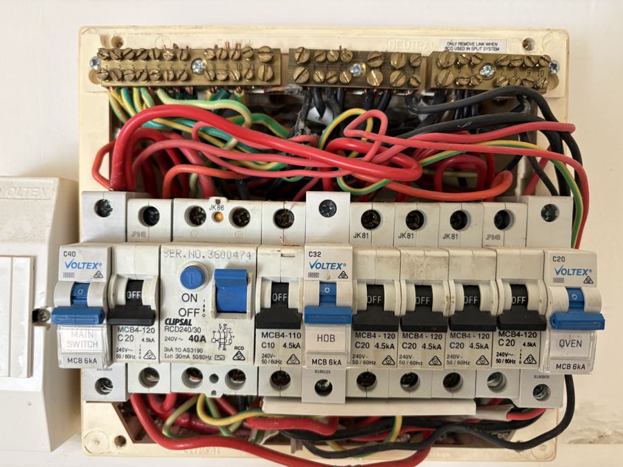 Switchboard interior wiring inspected during an electrical inspection